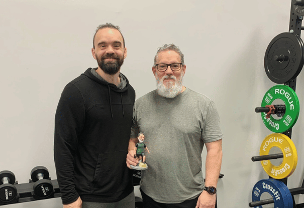 man with personal trainer at ROI Strength gym in midlothian virginia