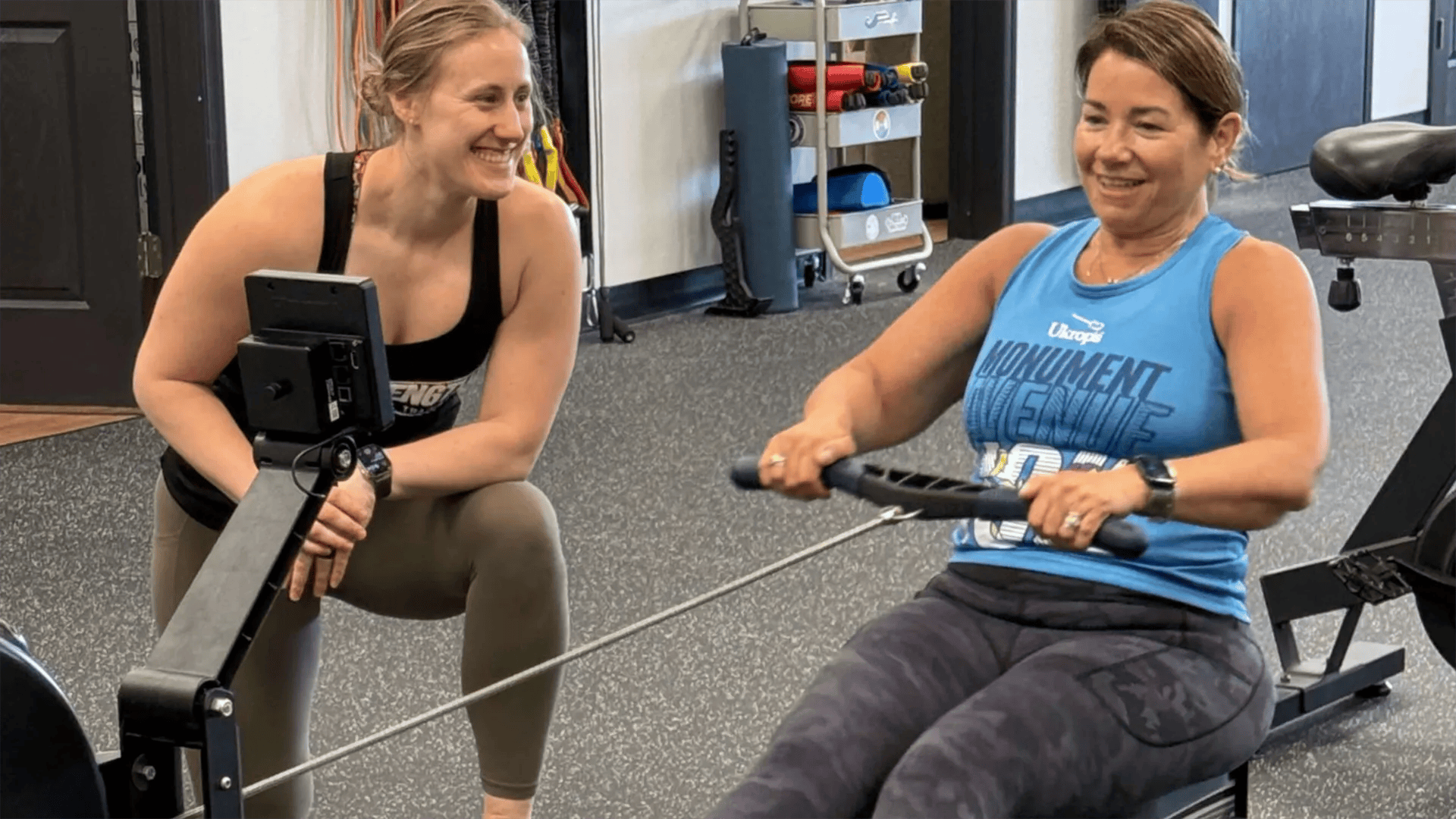 Woman training with her coach at ROI Strength