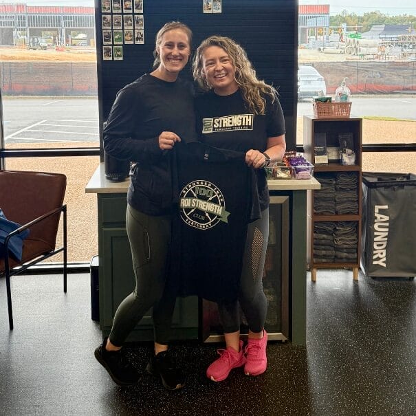 Woman celebrating fitness achievement at ROI Strength with Personal Trainer